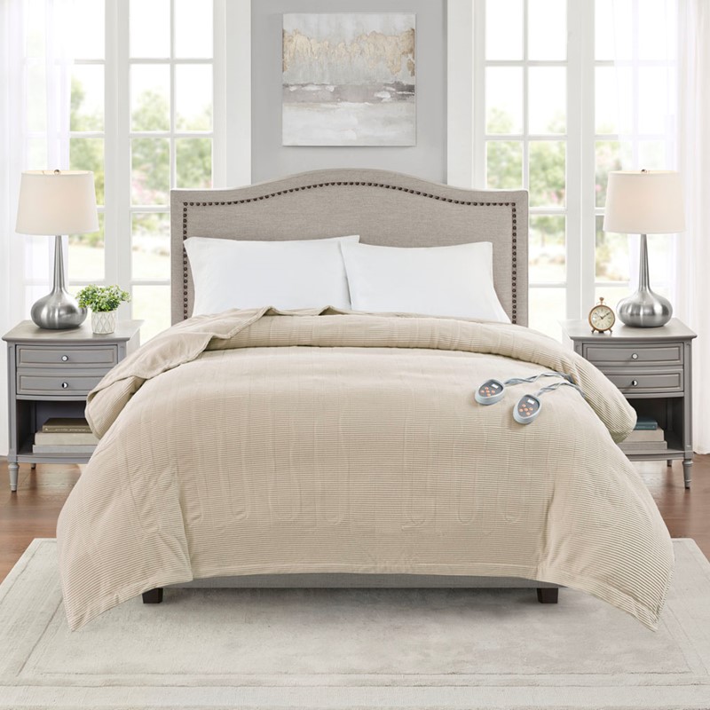 Beautyrest BR54-0182 beige heated bed blanket styled on a large bed; two wired control units are visible