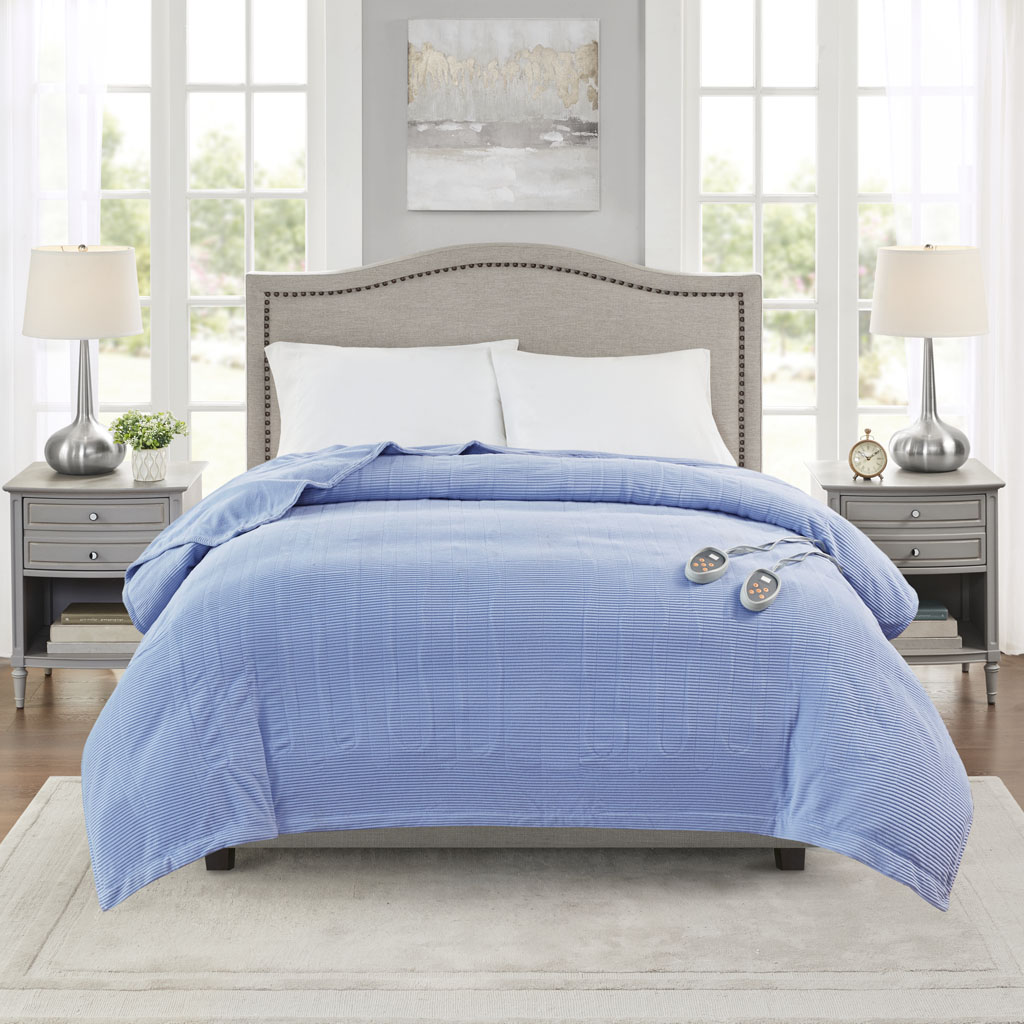 Official Olliix item image associated with Beautyrest BR54-0186 Blue King; a blue blanket spread over a large bed with two wired controls visible