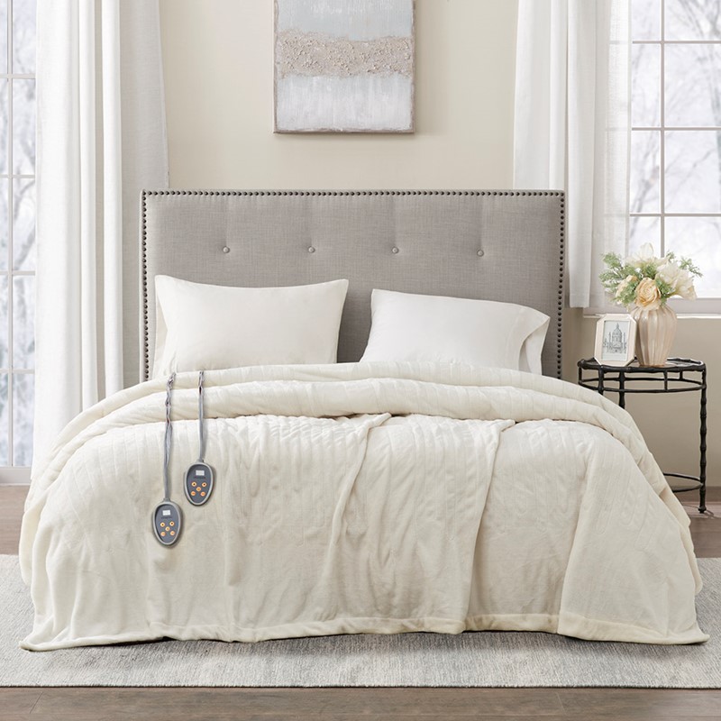 Official Olliix image associated with BR54-0523: ivory Queen heated blanket on a bed with two wired controls