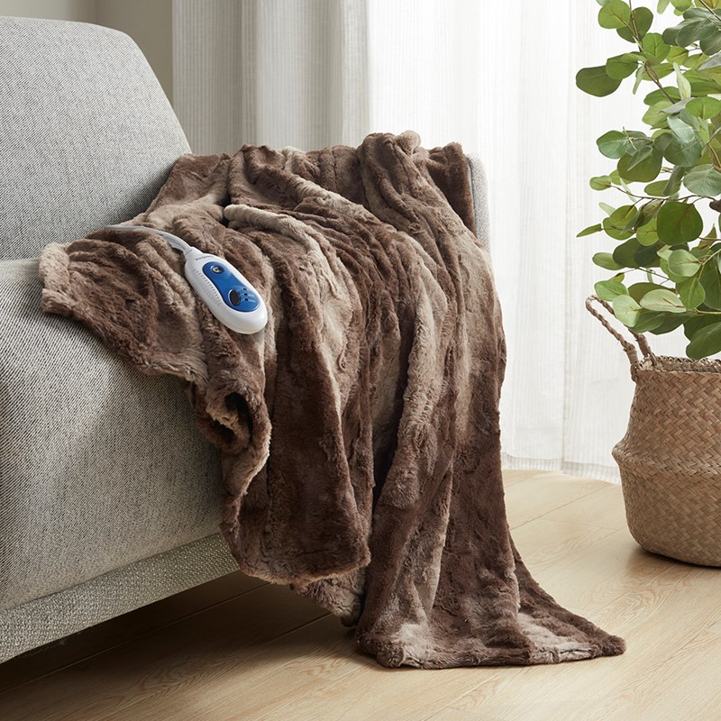 Brown-looking faux-fur heated throw draped over a chair with one wired controller; image association comes from the exact Olliix item record
