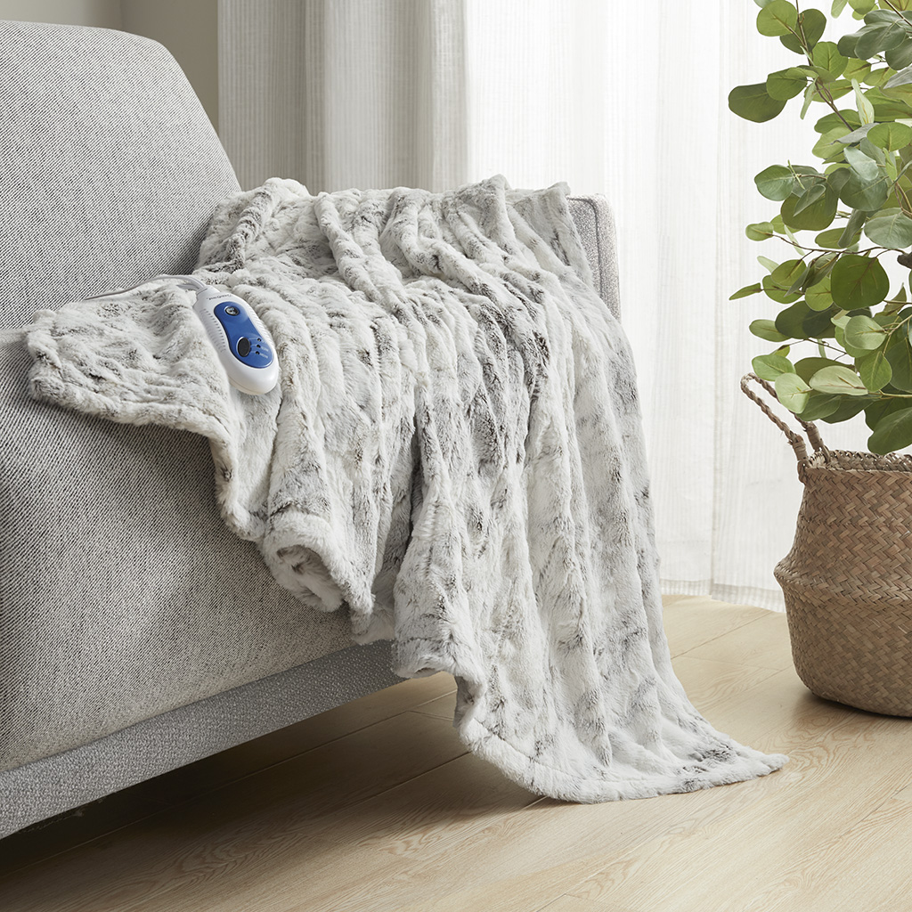 Olliix image associated with BR54-1371: Light marble-look throw with one handset visible; the image alone does not establish package contents