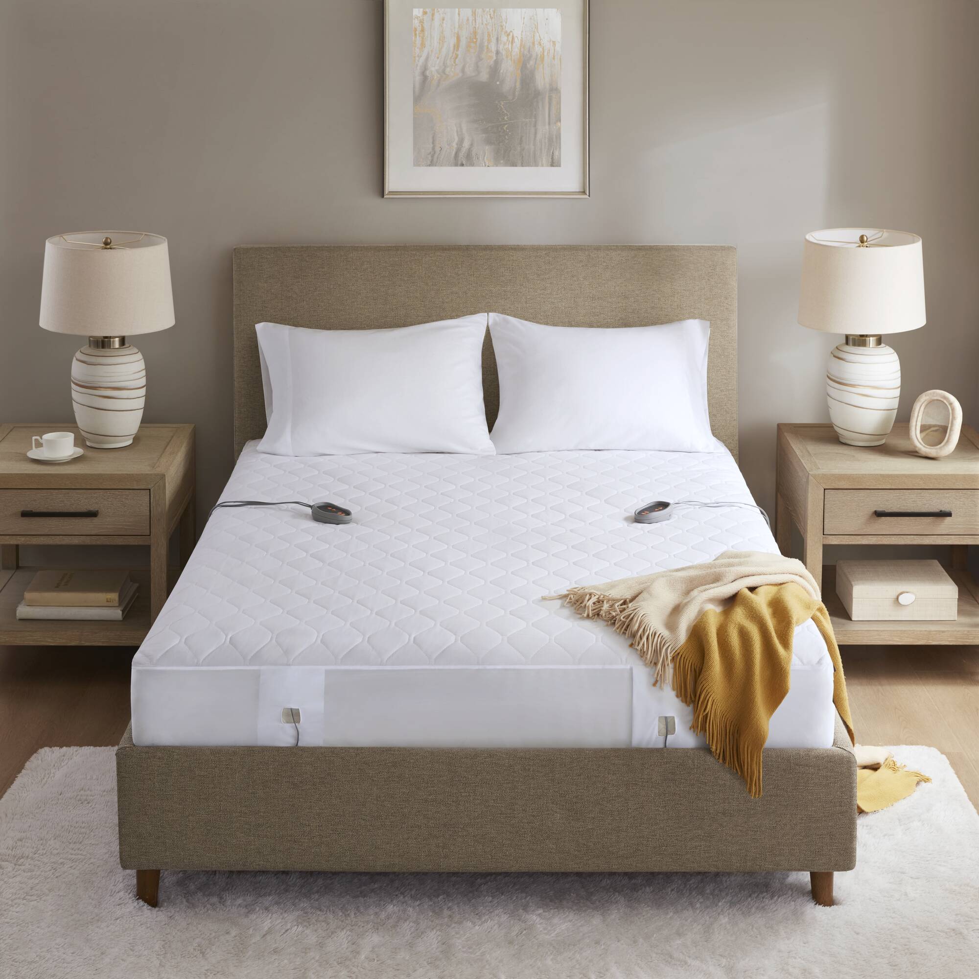 Manufacturer-linked staged white Beautyrest BR55-0201 King cotton-blend heated mattress pad with two visible hand controls.