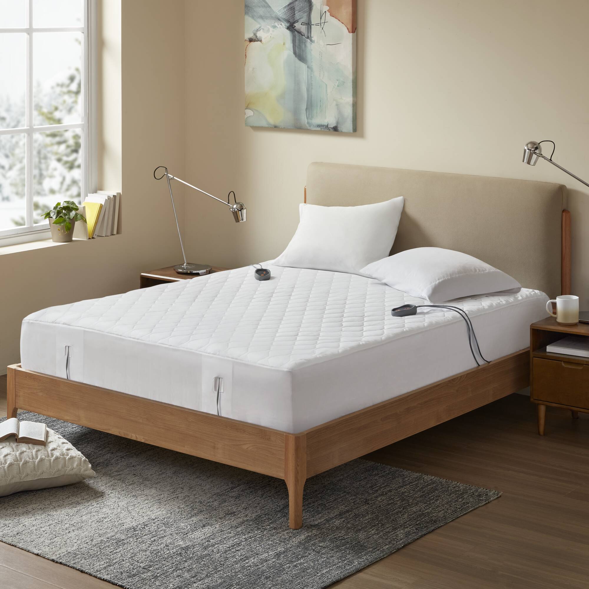 Official Olliix staged image of a white fitted heated mattress pad with two visible controllers, linked by exact item API to BR55-0535 Queen, BR55-0536 King and BR55-0537 California King
