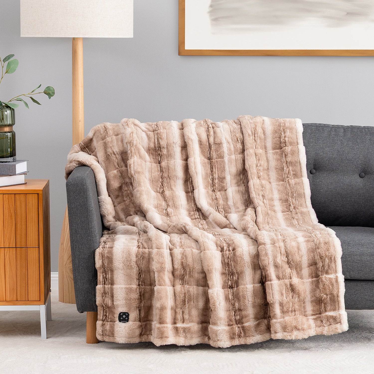 Striped Arctic Fur E0815 Berkshire heated throw displayed on a sofa