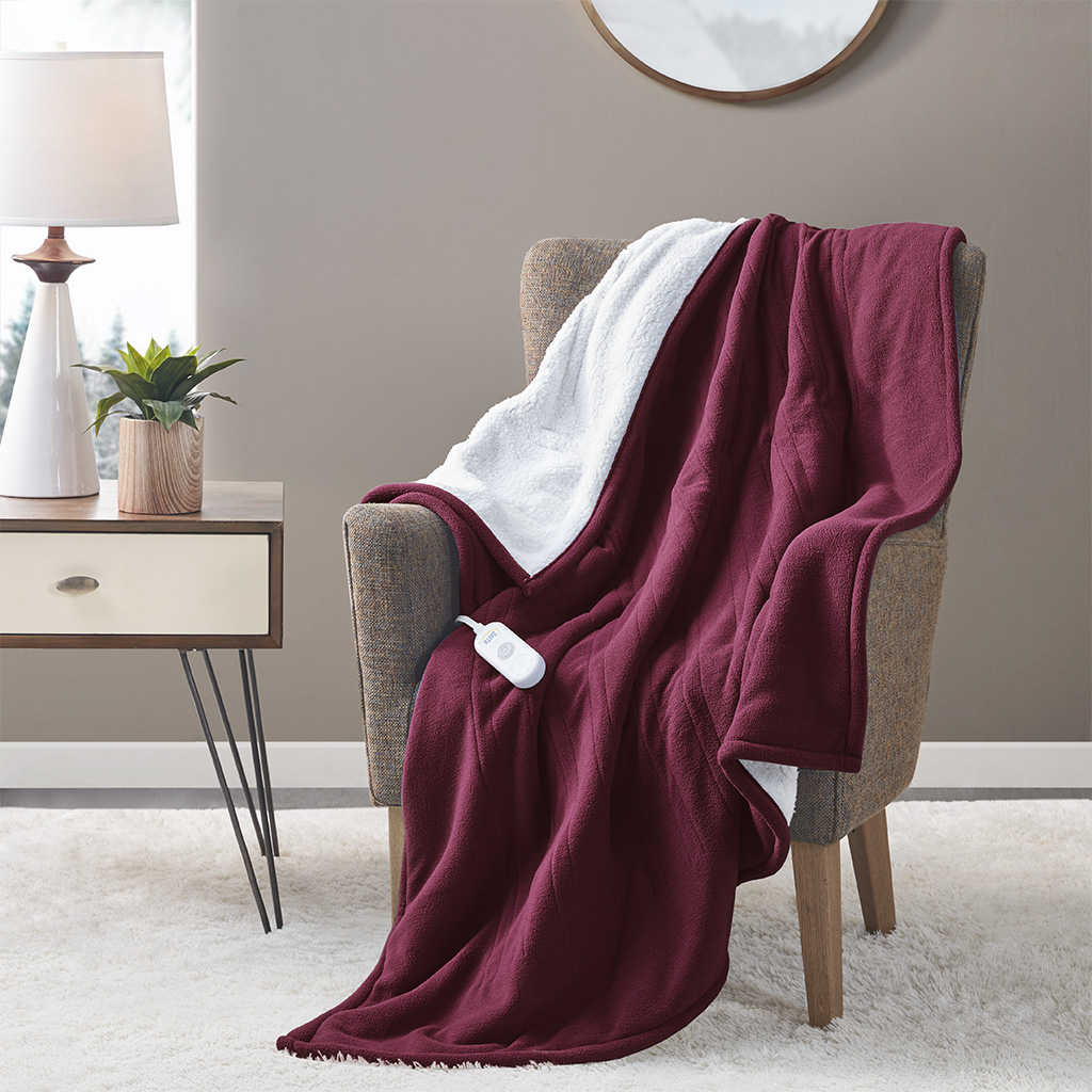 Official Serta ST54-0124 Burgundy 50 × 60 in heated throw draped on a chair with one controller