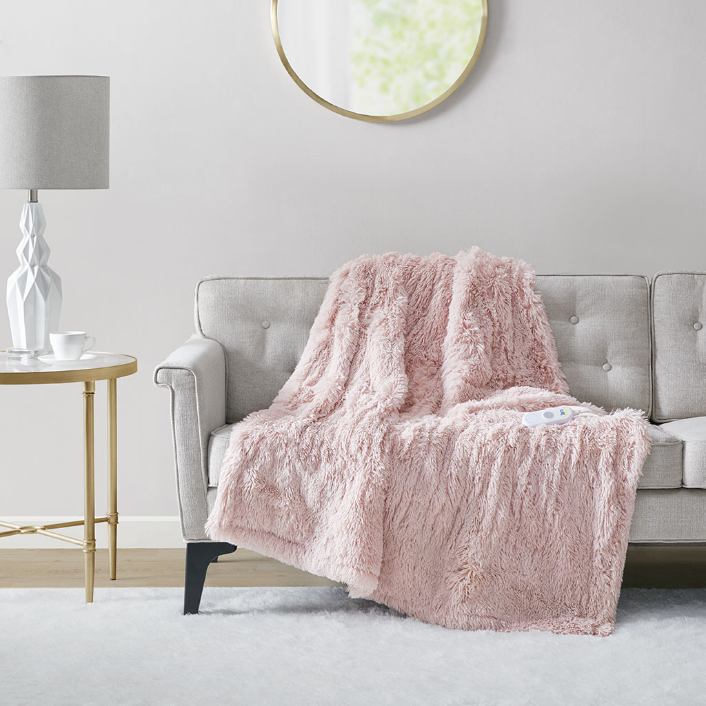 Official Serta Malea ST54-0152 Blush throw, visibly shaggy and shown with one controller