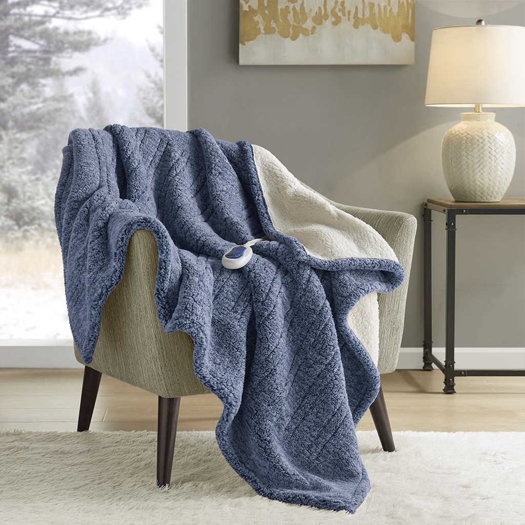 Official Blue True North TN54-0509 heated throw draped over a chair