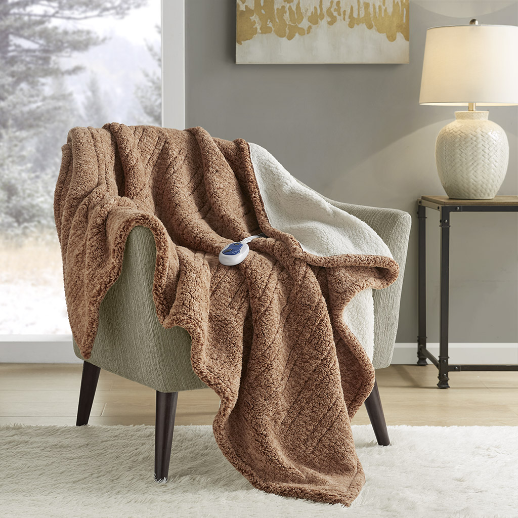Official Brown True North TN54-0507 heated throw draped over a chair