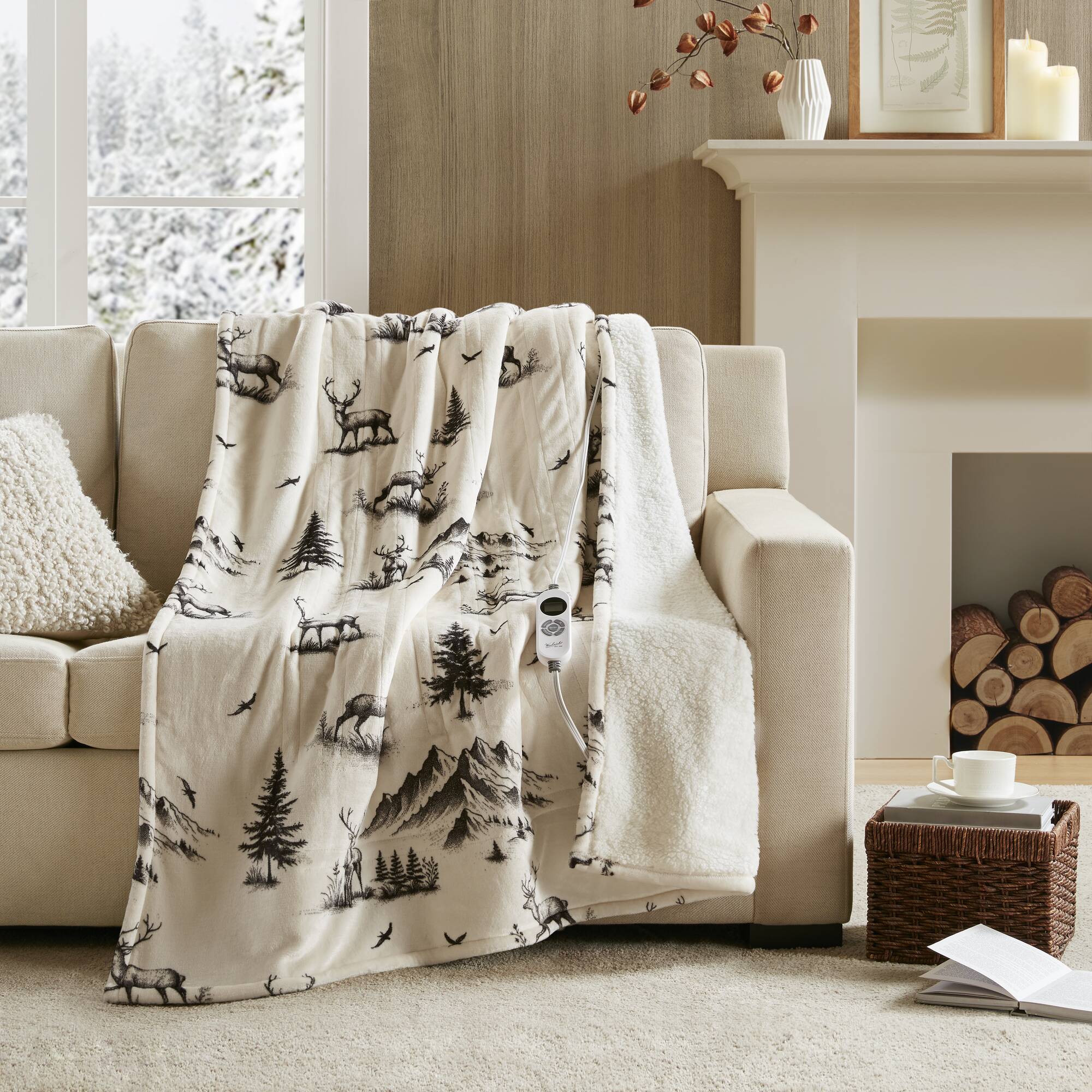 Woolrich WR54-3256 Deer print throw with light patterned face, ivory sherpa edge and one wired controller visible
