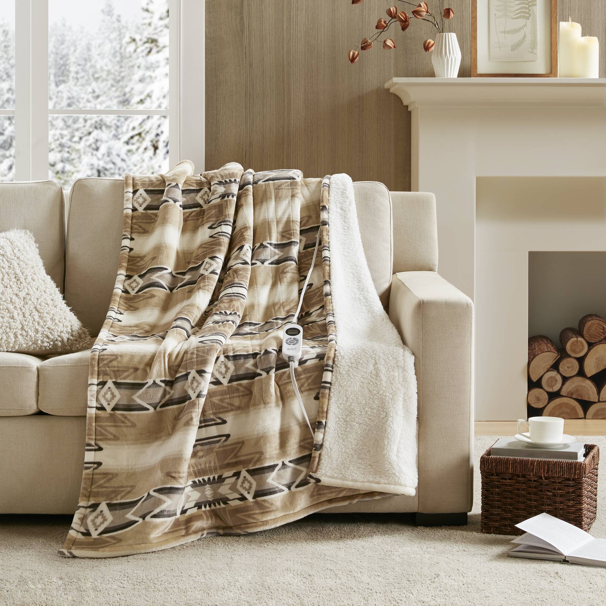 Woolrich WR54-3257 Aztec print throw in tan and brown, with ivory sherpa edge and one wired controller visible